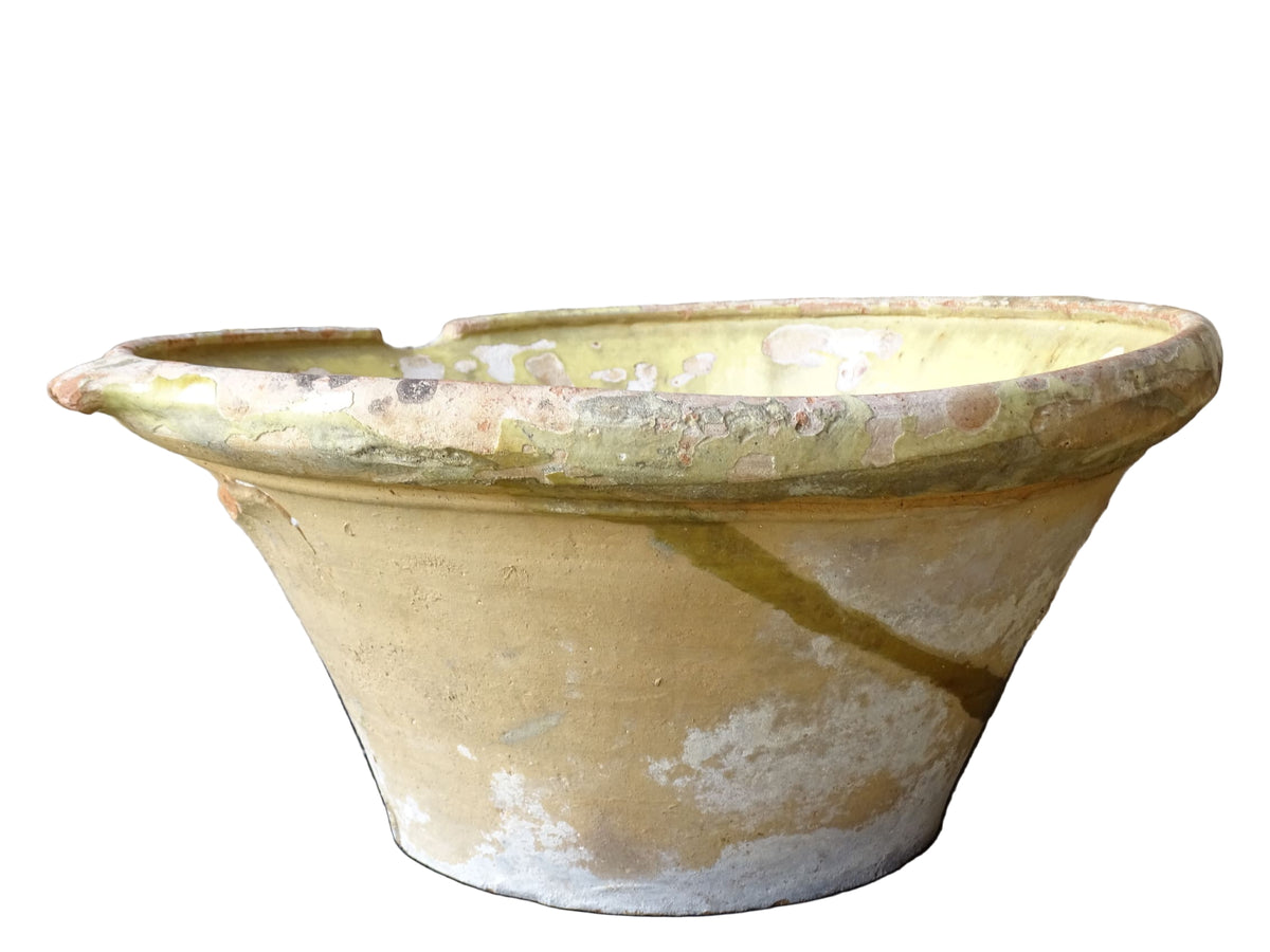 French antique tian bowl with a yellow glazed interior. Old terracotta confit bowl from the 19th century.