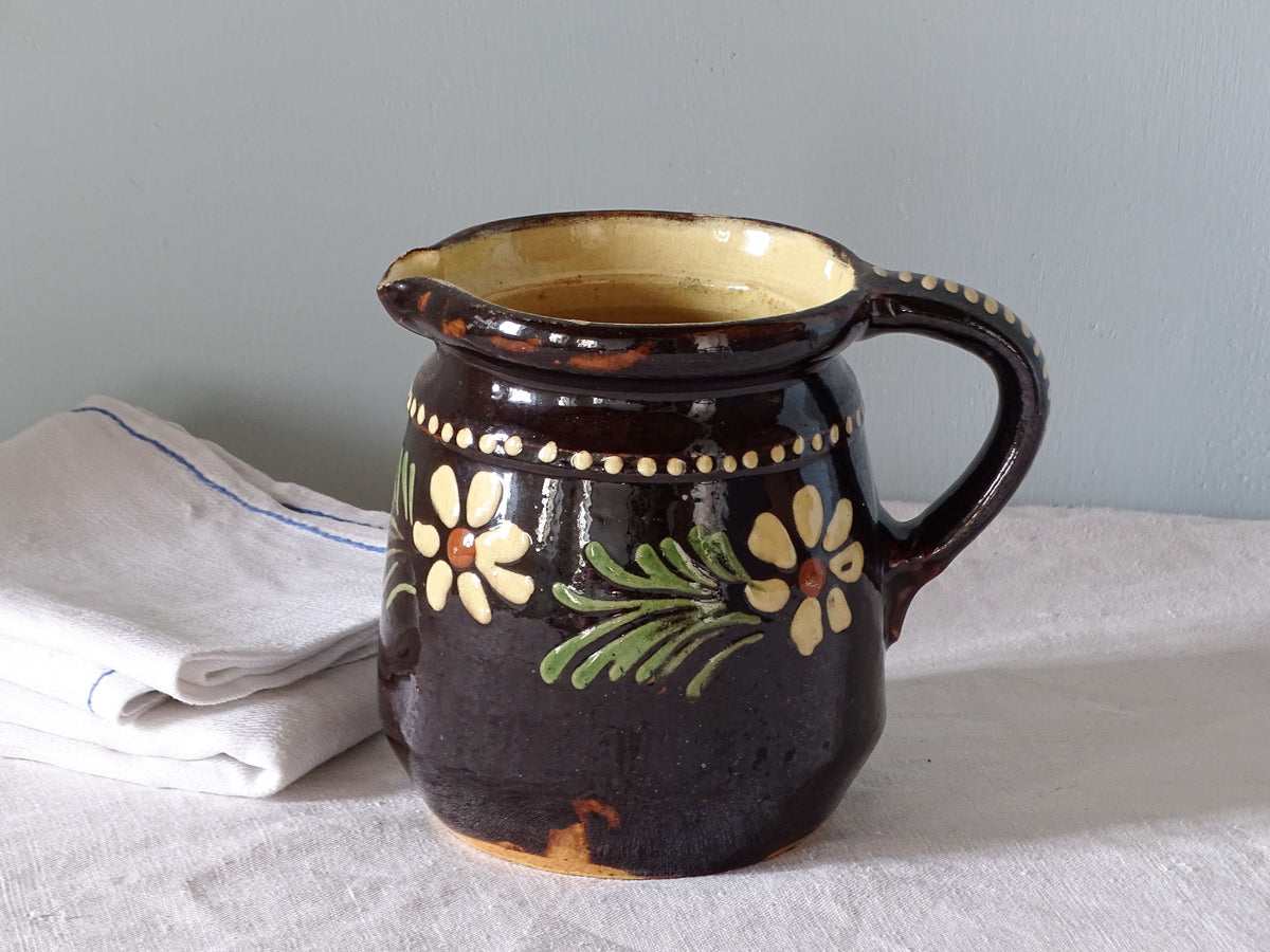 French vintage ceramic jug from Alsace with brown glaze and hand-painted flowers