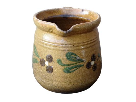 Small French vintage pottery jug from Alsace with flowers. Brown glazed ceramic pitcher.
