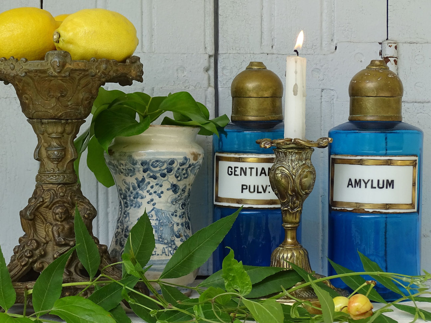 French antique blue glass apothecary bottles, French antique candle holder and Italian antique albarello medicine jar
