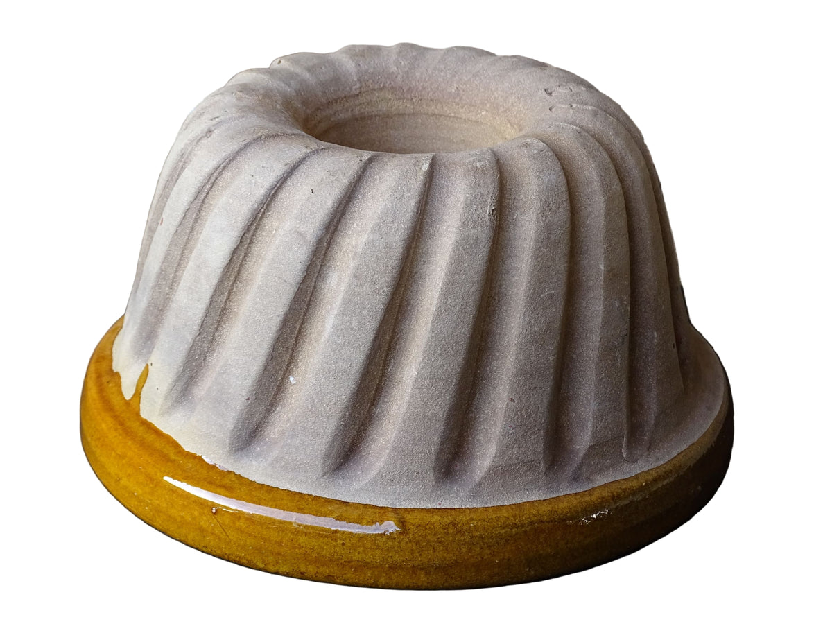 French vintage ceramic mould with a yellow glaze interior and unglazed exterior.
