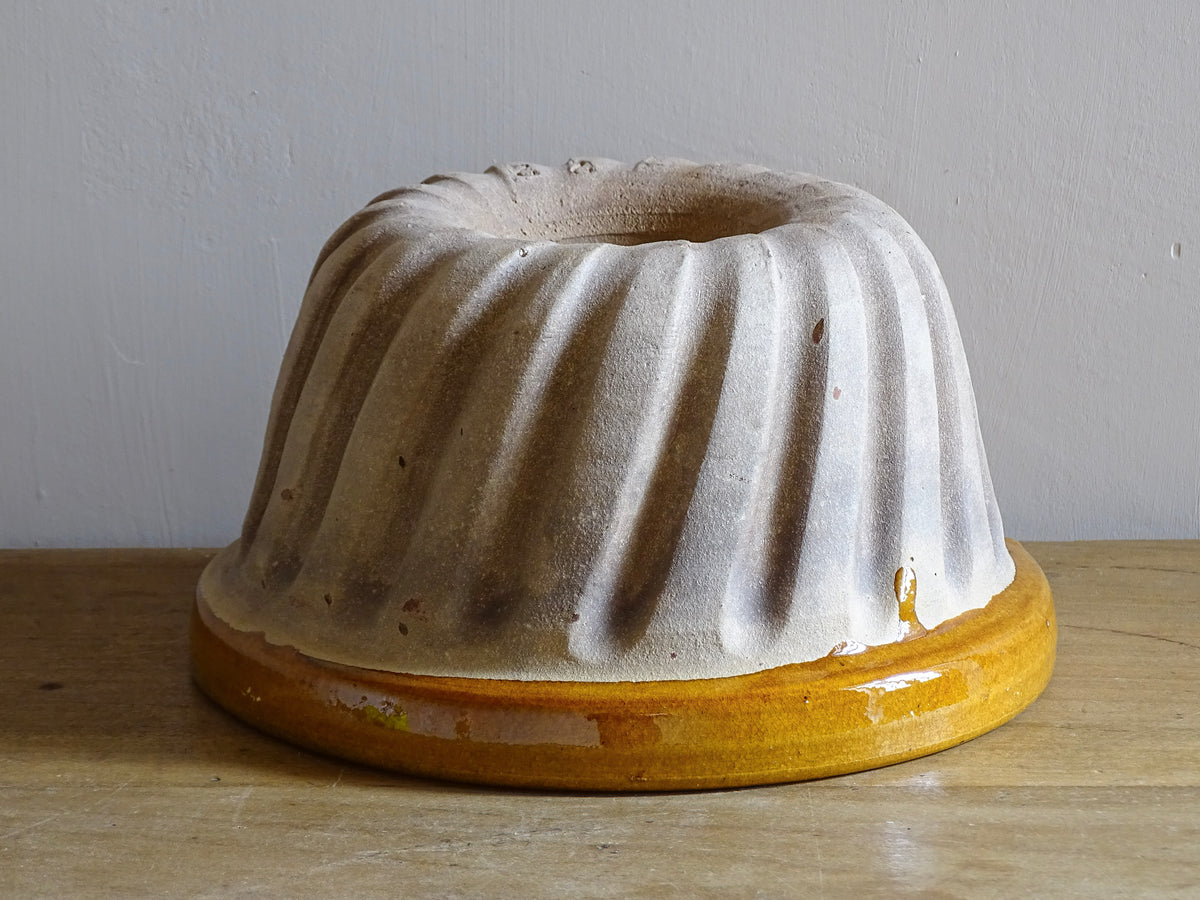 French vintage ceramic mould with a yellow glaze interior and unglazed exterior.