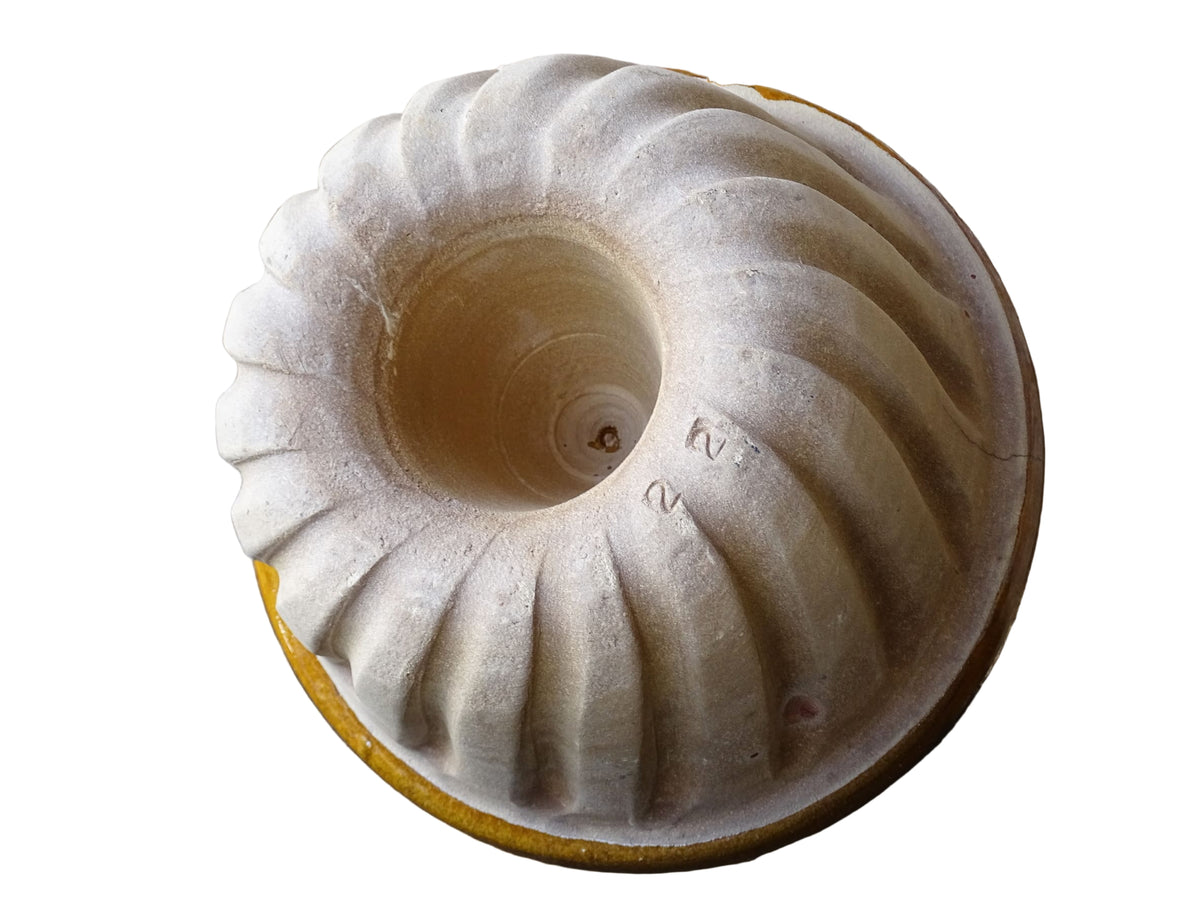 French vintage ceramic mould with a yellow glaze interior and unglazed exterior.