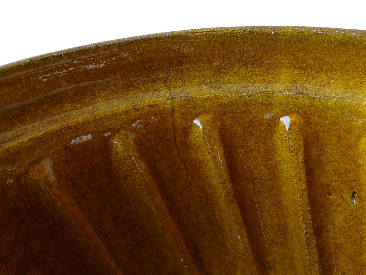French vintage ceramic mould with a yellow glaze interior and unglazed exterior.