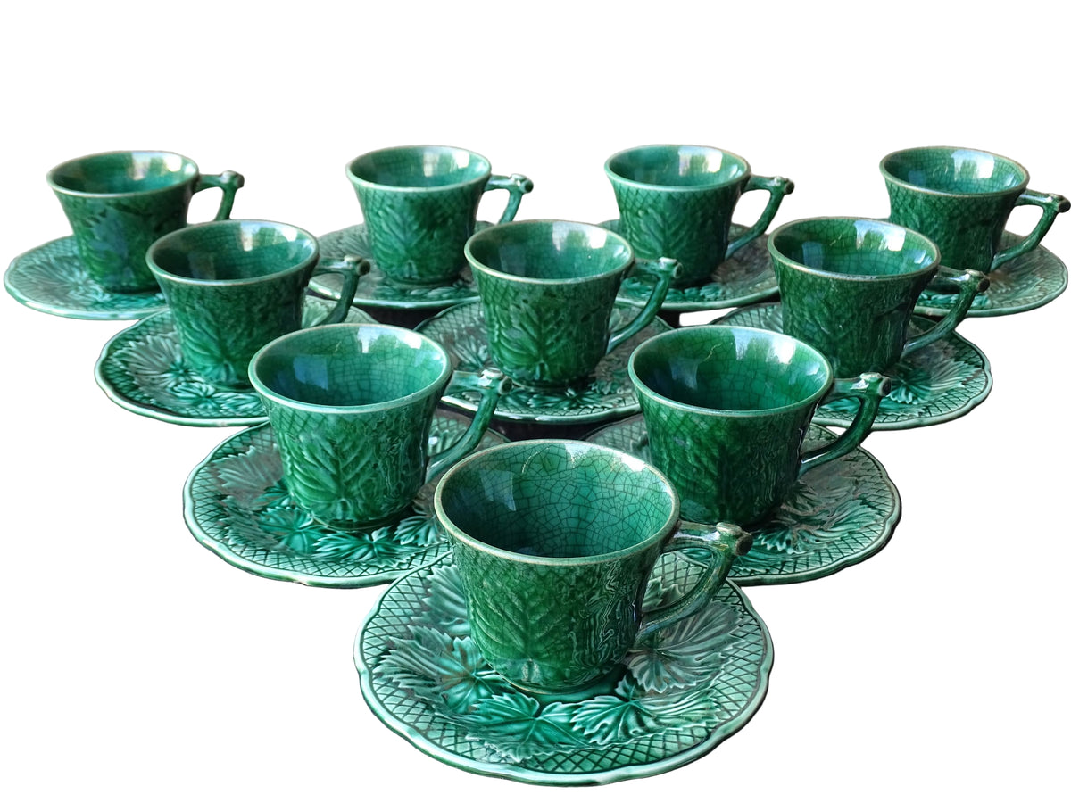 Set of 10 vintage coffee cups by Gien in the Primefleur design. Green glazed ceramic cups and saucers. Barbotine or majolica cups.