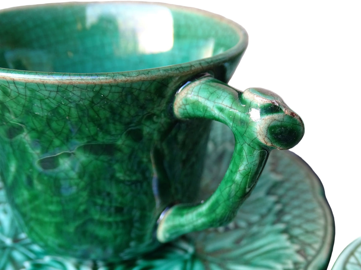 Set of 10 vintage coffee cups by Gien in the Primefleur design with leaf patterns. Green glazed ceramic cups and saucers. Barbotine or majolica cups.