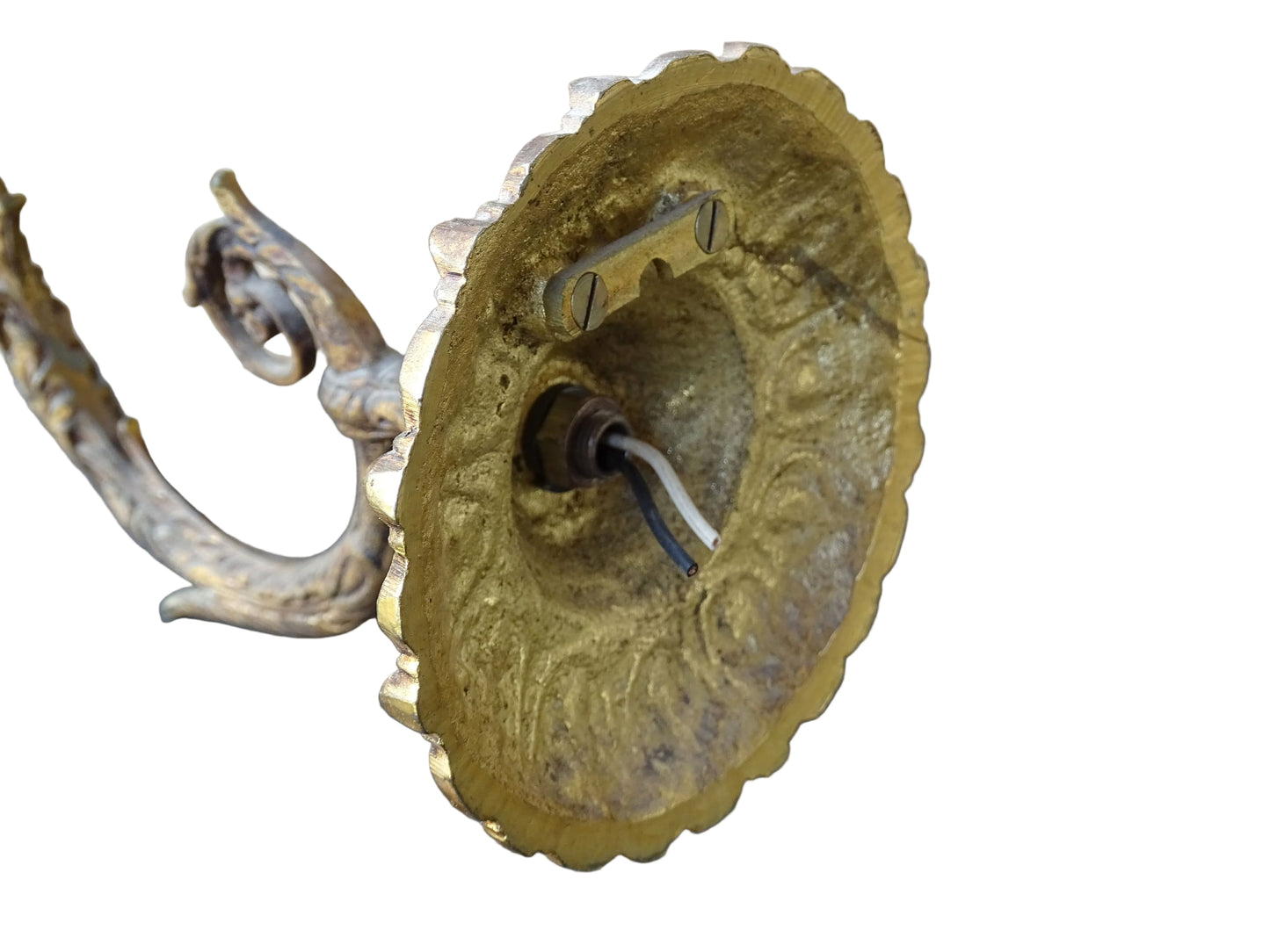 A beautiful French vintage wall light made from gilded metal with a clear cut-glass lantern. The frame has small finials to the top, leaf motifs around the sides, and an ornate scrolling arm. The glass has a diamond pattern.