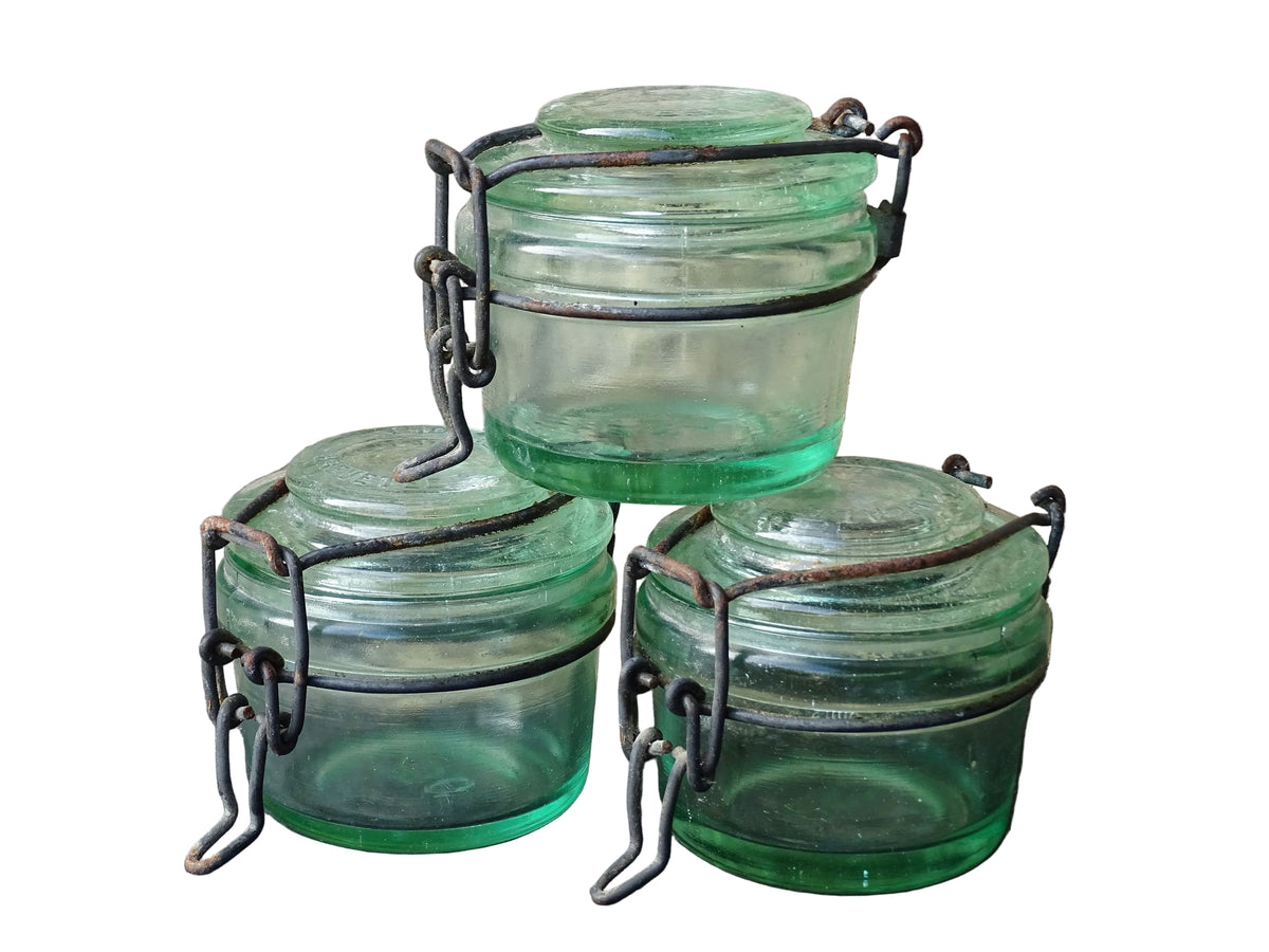 French vintage green glass jars by L'Ideale with metal clasps. Canning or preserving jars with lids.