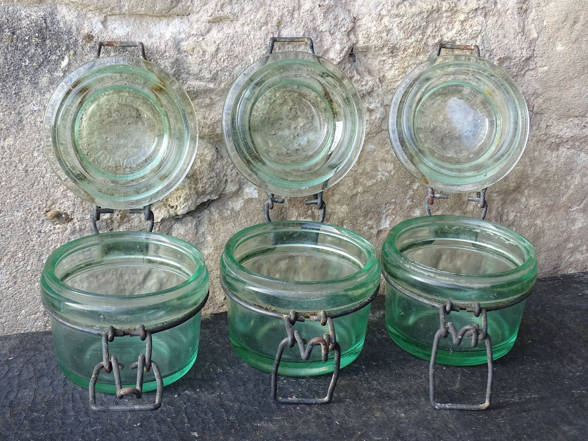 French vintage green glass jars by L'Ideale with metal clasps. Canning or preserving jars with lids.
