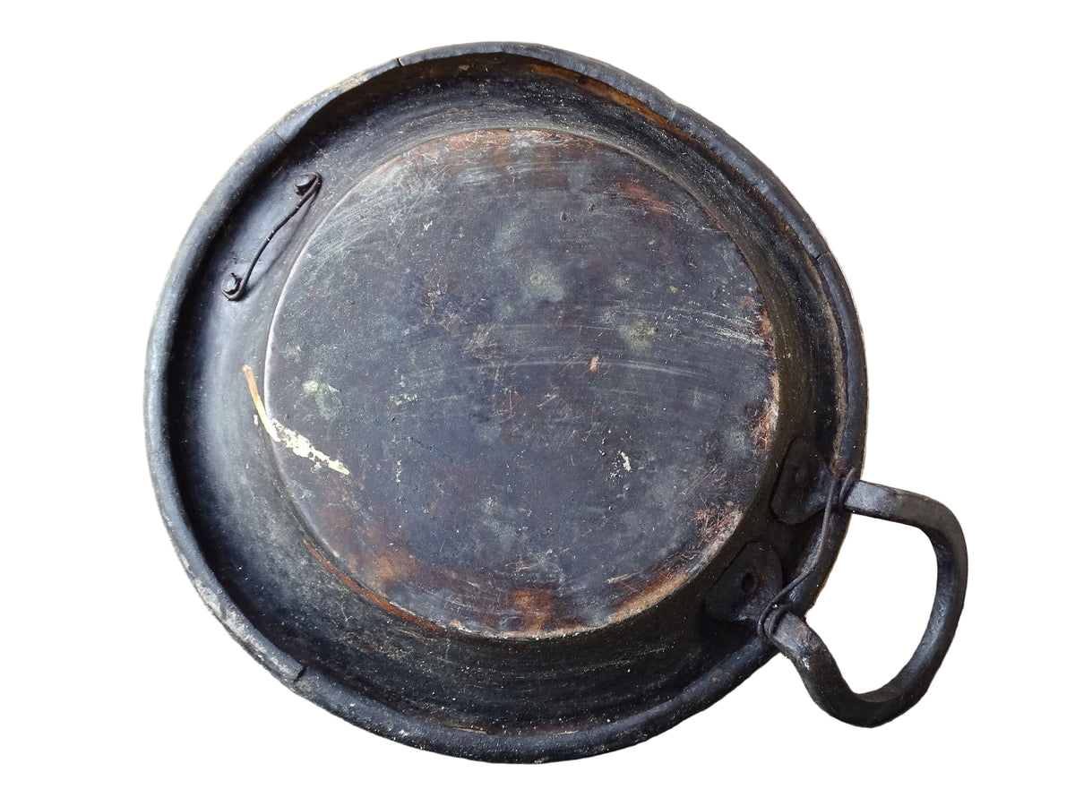 French antique copper pan with a wrought iron handle.