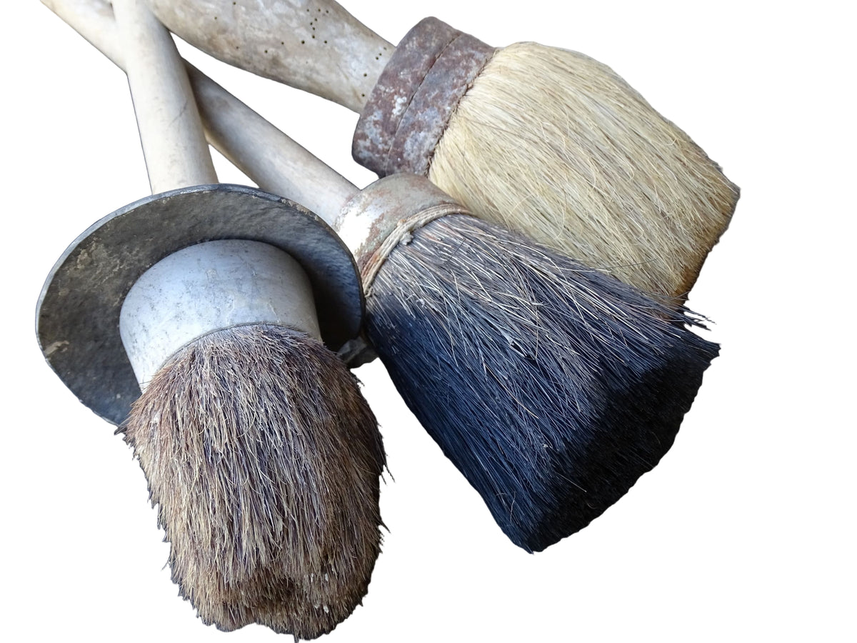 Three old French vintage paint brushes with wooden handles and horse hair brushes.