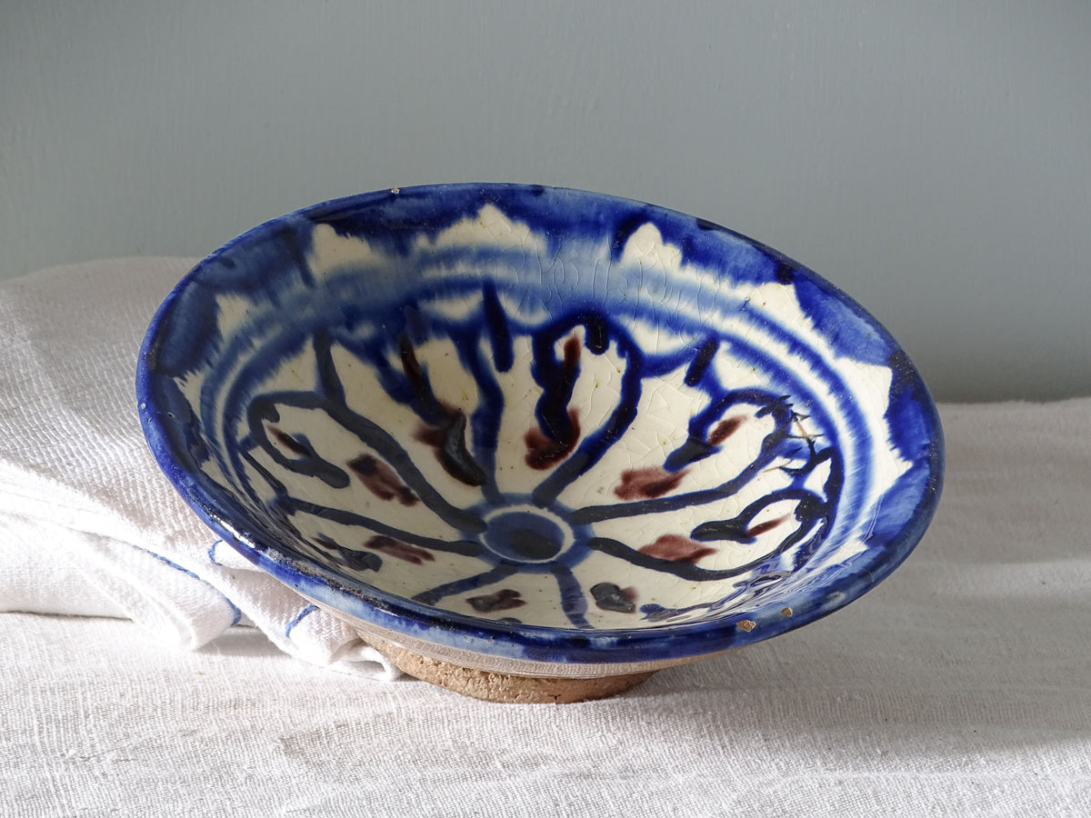 Small vintage moroccan ceramic dish with blue patterned glaze and touches of manganese