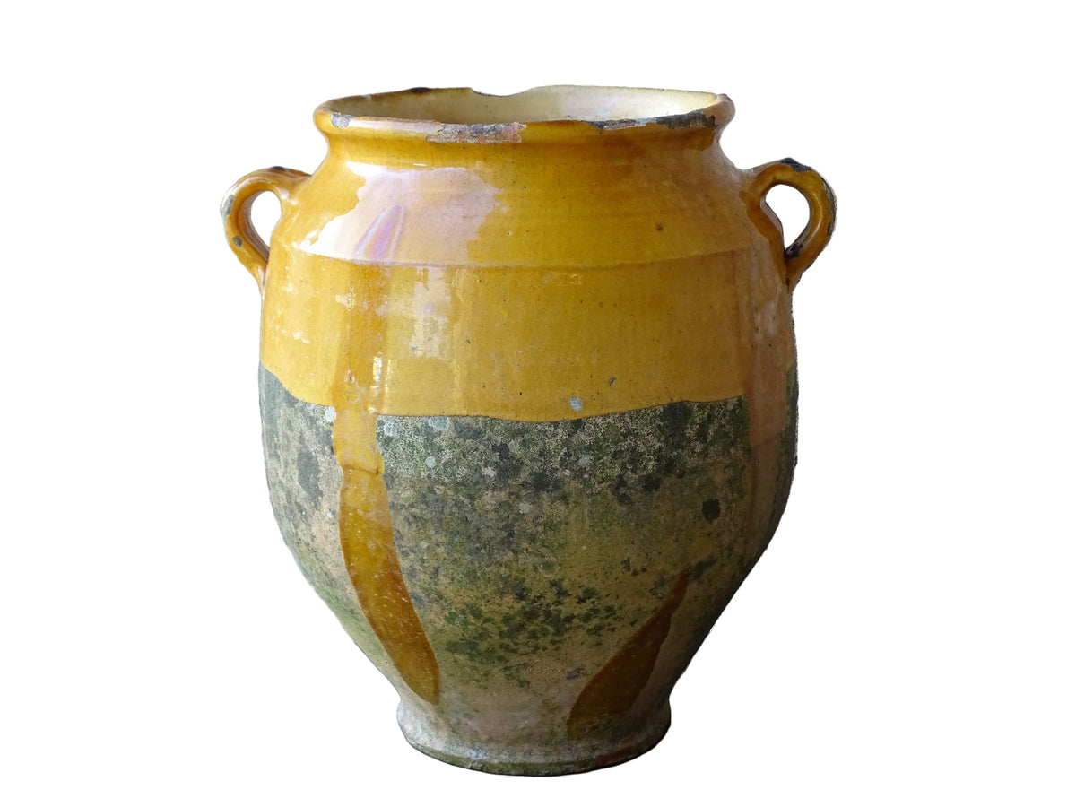 French antique confit pot with mustard yellow glaze. Terracotta jar with two handles.