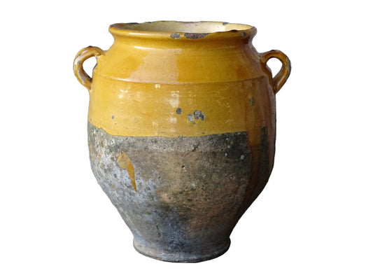 French antique confit pot with mustard yellow glaze. Terracotta jar with two handles.