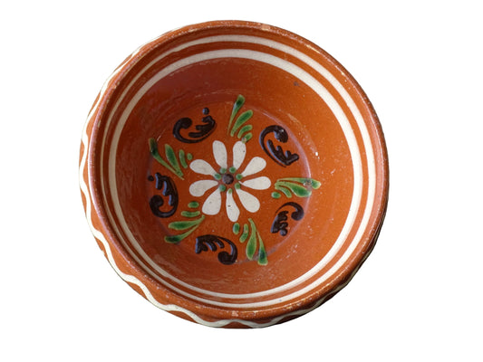 French vintage pottery bowl from Alsace. Glazed terracotta dish with painted flowers.