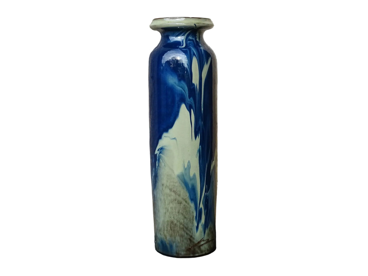 Vintage ceramic vase with a blue and cream glaze. Tall glazed terracotta vase, signed.