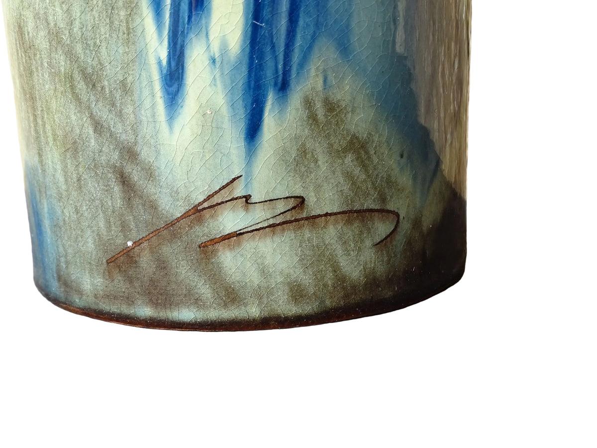 Vintage ceramic vase with a blue and cream glaze. Tall glazed terracotta vase, signed.