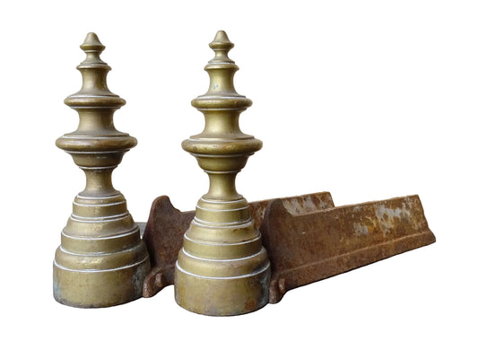 Pair of French antique brass andirons or firedogs with turned forms and cast iron backs.