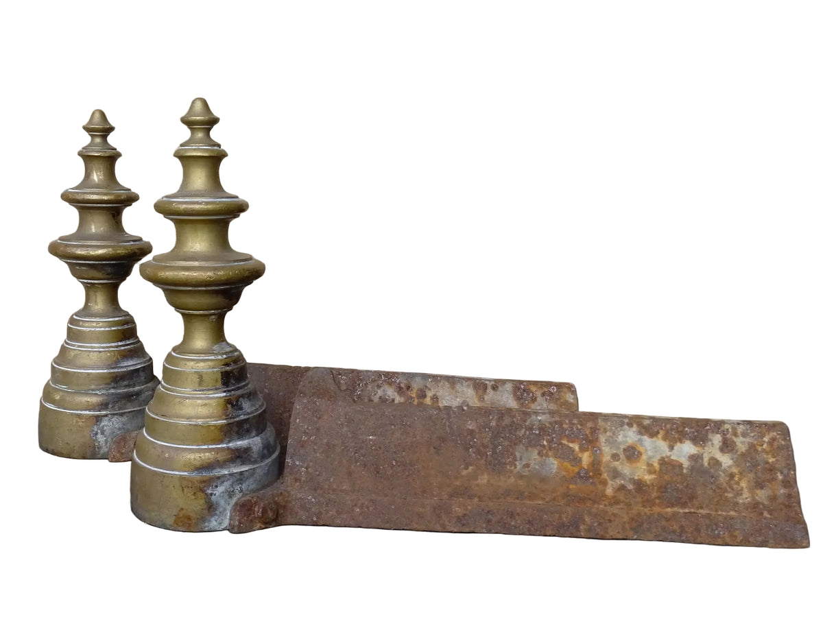 Pair of French antique brass andirons or firedogs with turned forms and cast iron backs.