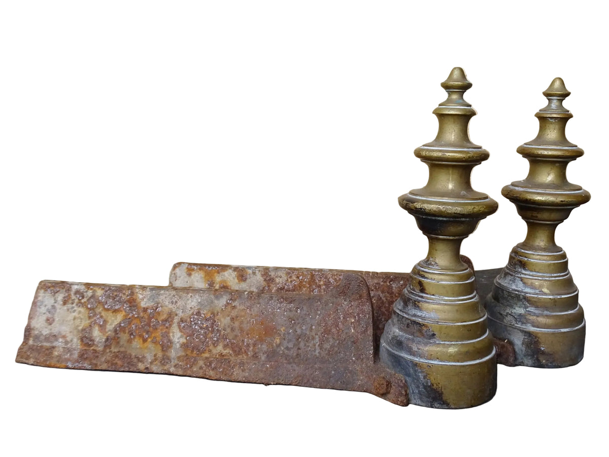 Pair of French antique brass andirons or firedogs with turned forms and cast iron backs.