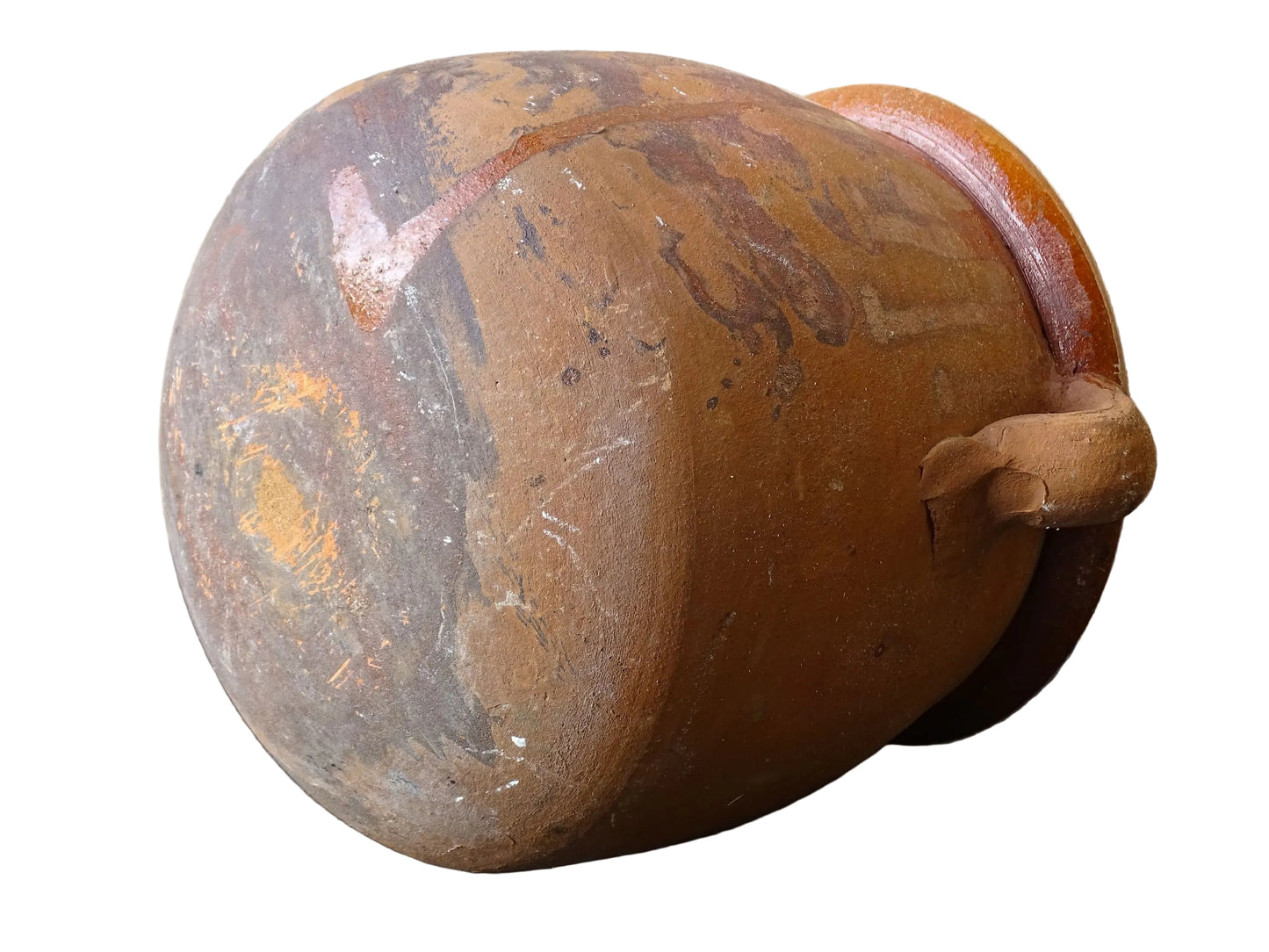 French vintage terracotta pot with orange glaze interior and drip glaze around the sides. Earthenware confit jar with two handles and a curved base.