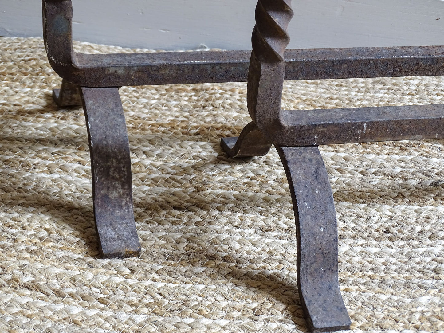 andirons or firedogs. They date to the 19th century. They are beautifully aged and have acorn finials and barley twist detailing.