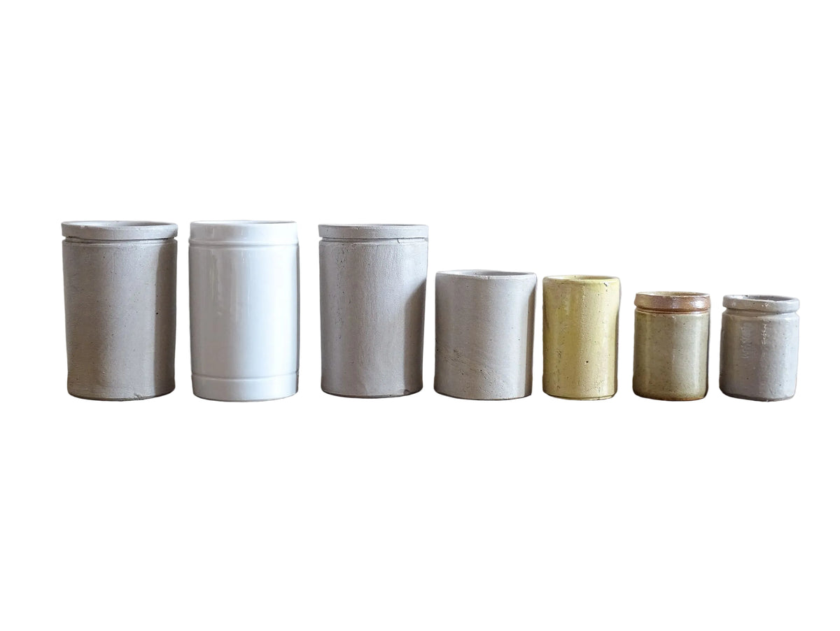 A set of seven small French vintage stoneware pots. This collection of pottery jars would look amazing as part of a rustic French farmhouse style home. Display in your kitchen as part of your shelf decor.