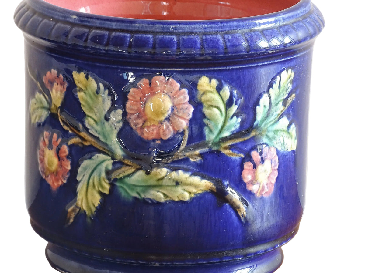 French antique barbotine ceramic planter. A lovely, cobalt blue cache-pot which is beautifully decorated with pink and yellow flowers along with green foliage.