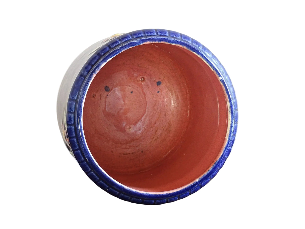 French antique barbotine ceramic planter. A lovely, cobalt blue cache-pot which is beautifully decorated with pink and yellow flowers along with green foliage.
