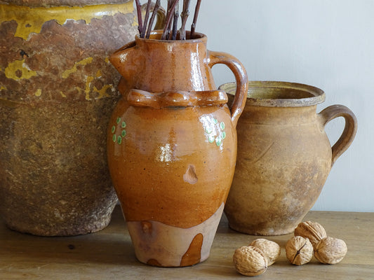 French antique terracotta pitcher from Savoie with orange glaze and yellow dots. Savoyard pottery jug with applied detailing.