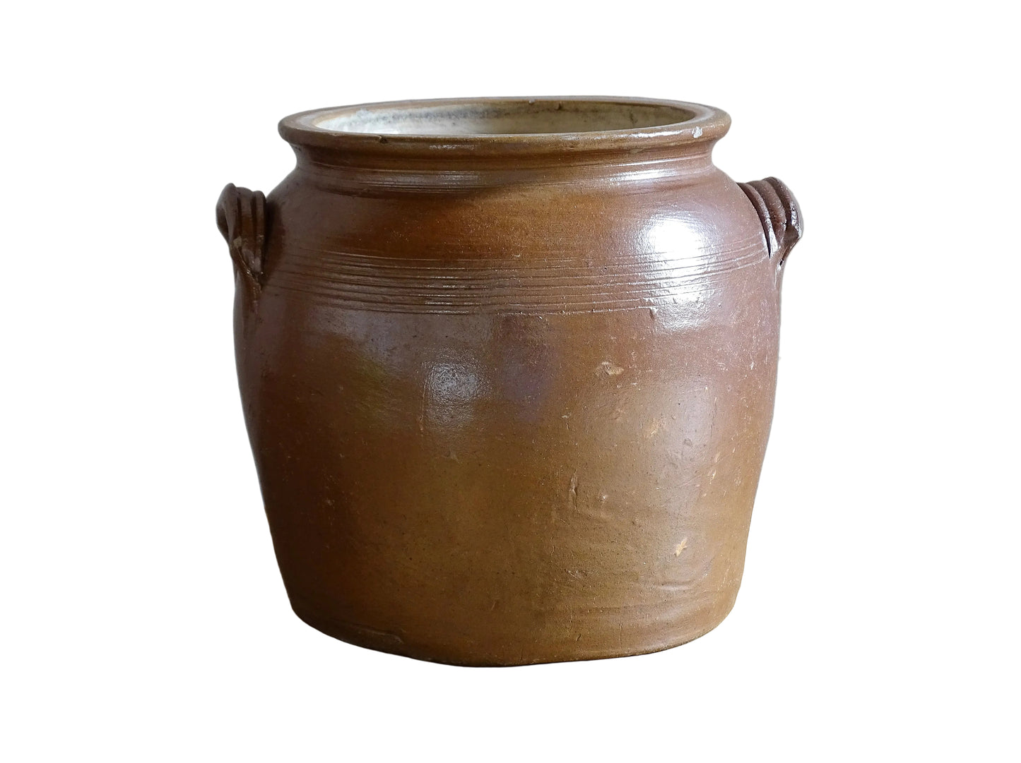 A French antique stoneware confit pot with a brown glaze. This is a salt glazed pottery cache pot. It dates to the early 20th century and would look amazing as part of a rustic French farmhouse style home.