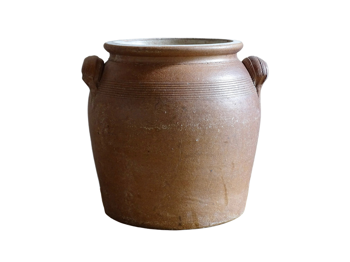 A French antique stoneware confit pot with a brown glaze. This is a salt glazed pottery cache pot. It dates to the early 20th century and would look amazing as part of a rustic French farmhouse style home.