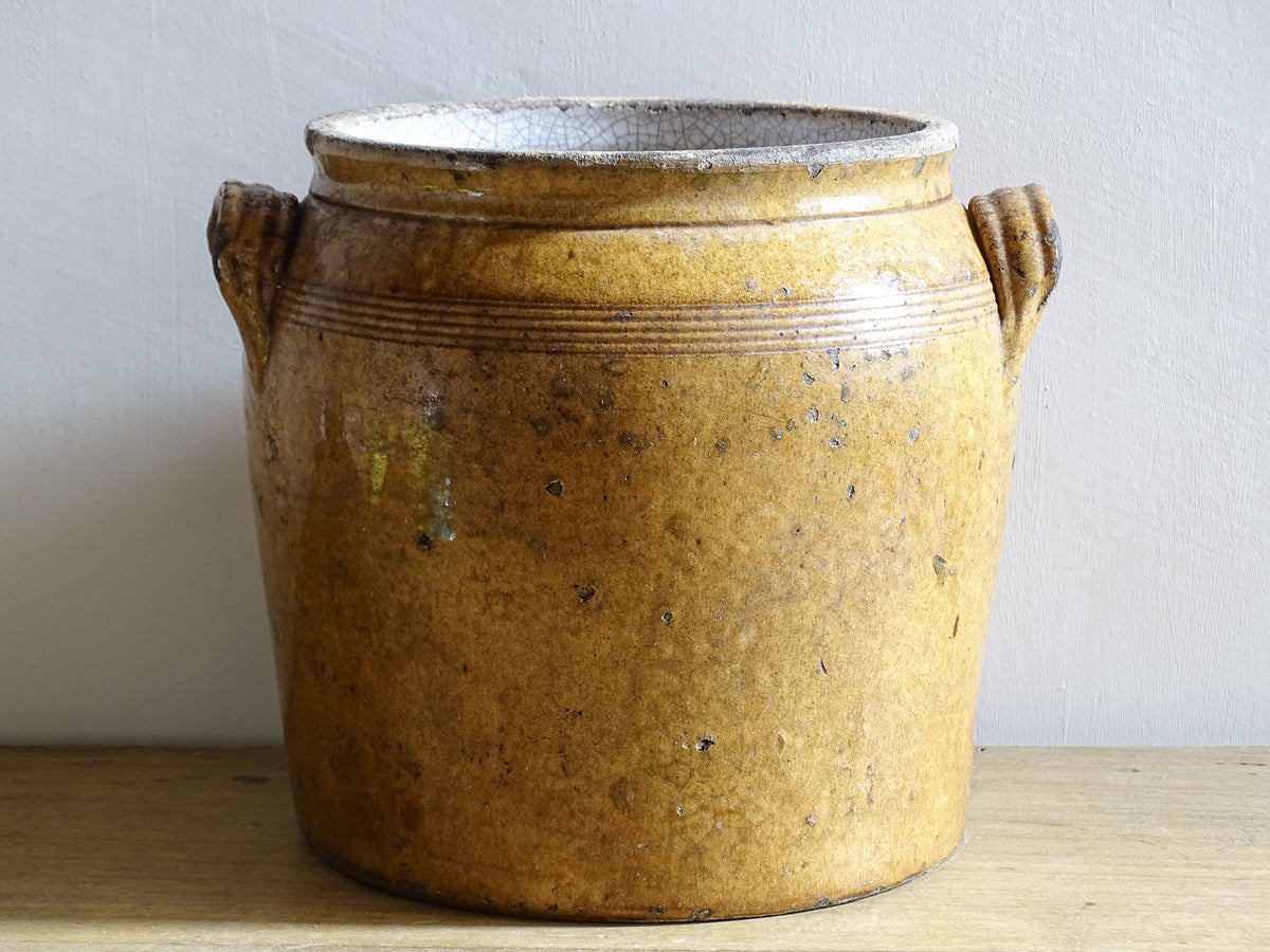 French antique ceramic pot or stoneware confit jar with brown glaze and rich patina.