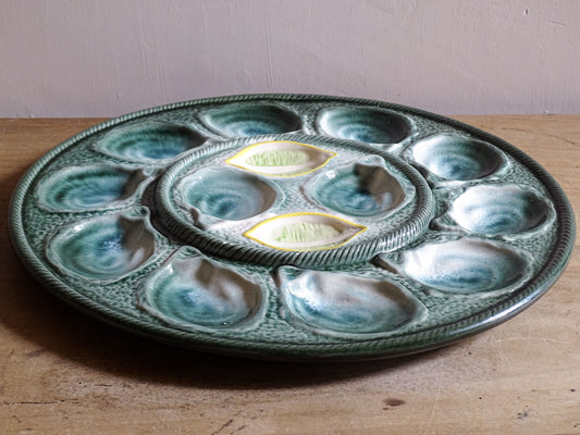 French ceramic oyster serving platter by St Clément with sculpted shell compartments and mottled green glaze.