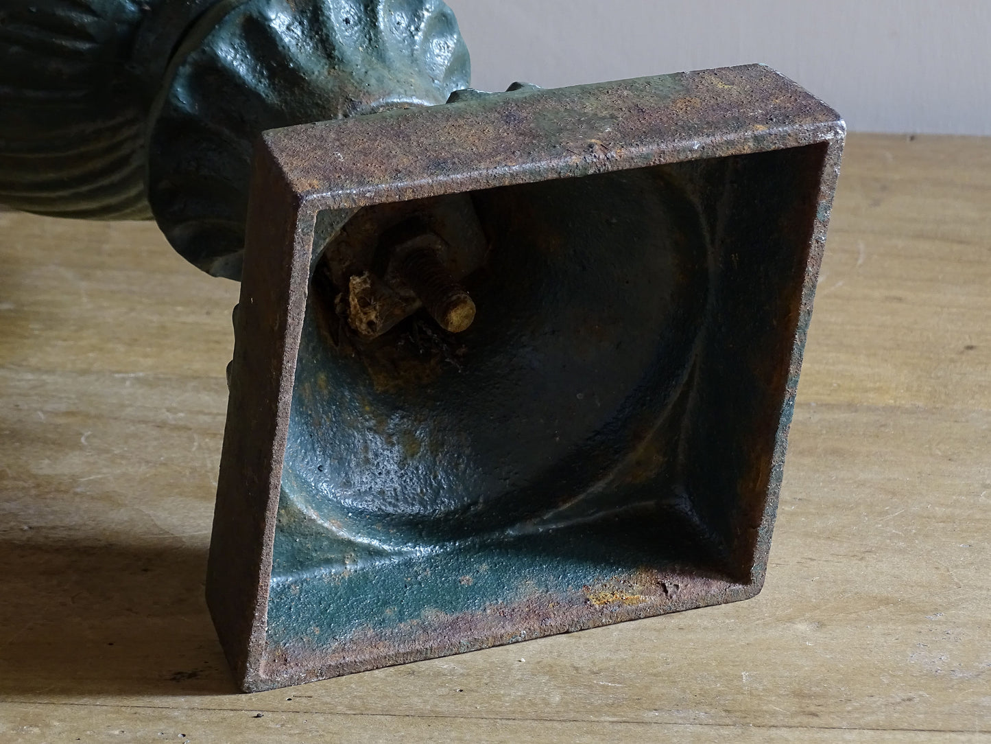 Antique cast iron campana garden urn with weathered green patina