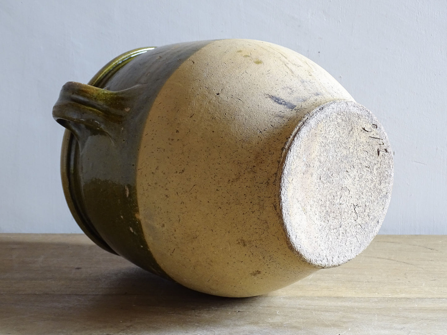 Antique French pottery jar with olive green glaze and rustic patina