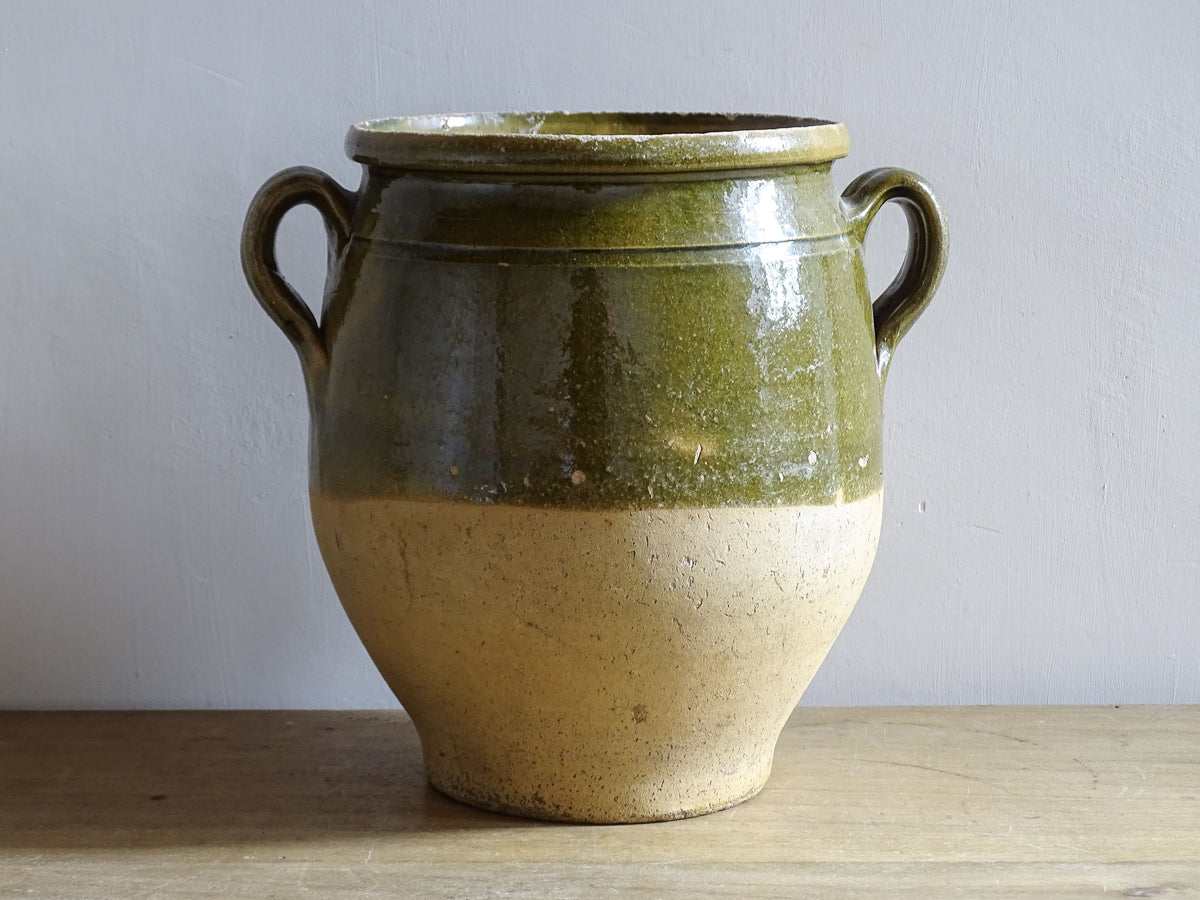 French antique confit pot with green glazed upper half and twin handles