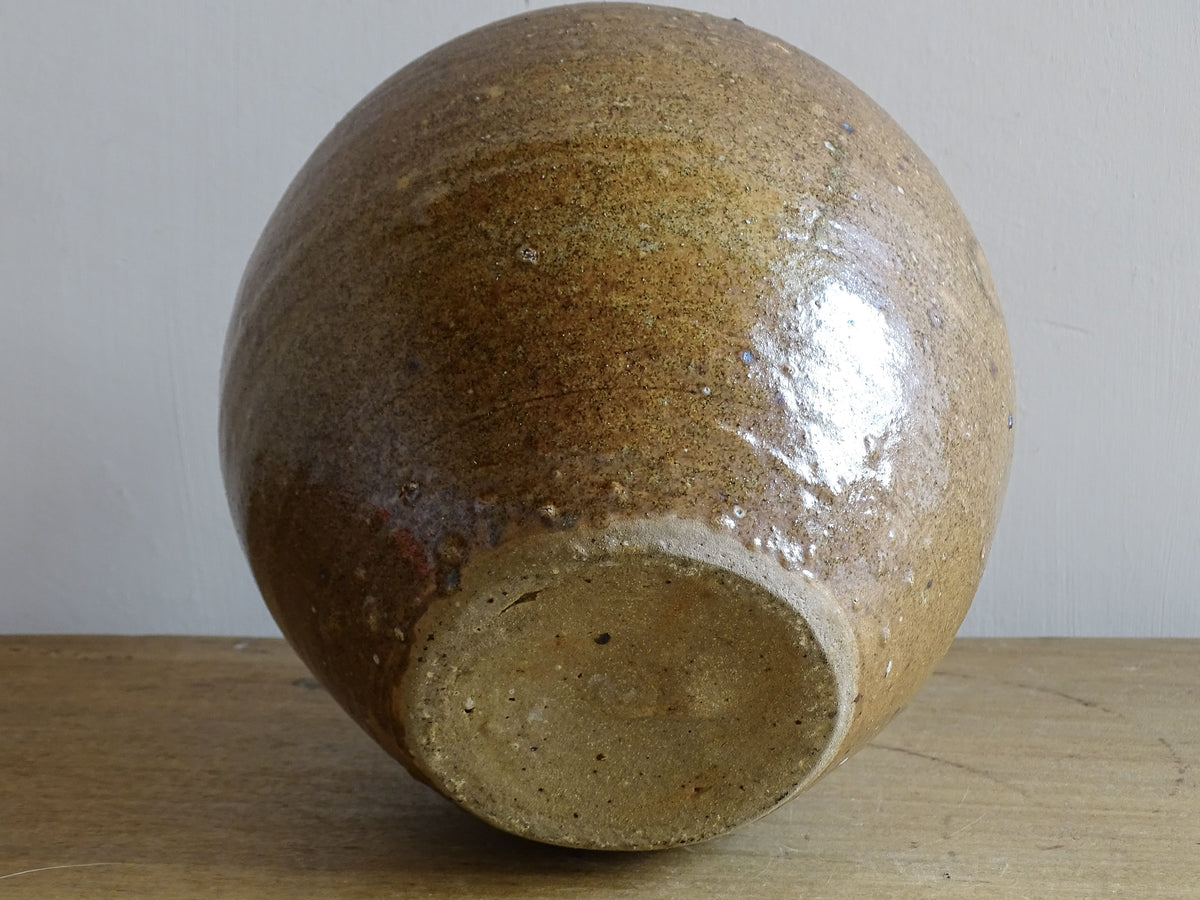 A rustic French antique pottery water or wine pitcher. It has gorgeous warm brown tones. This ceramic jug dates from the nineteenth century