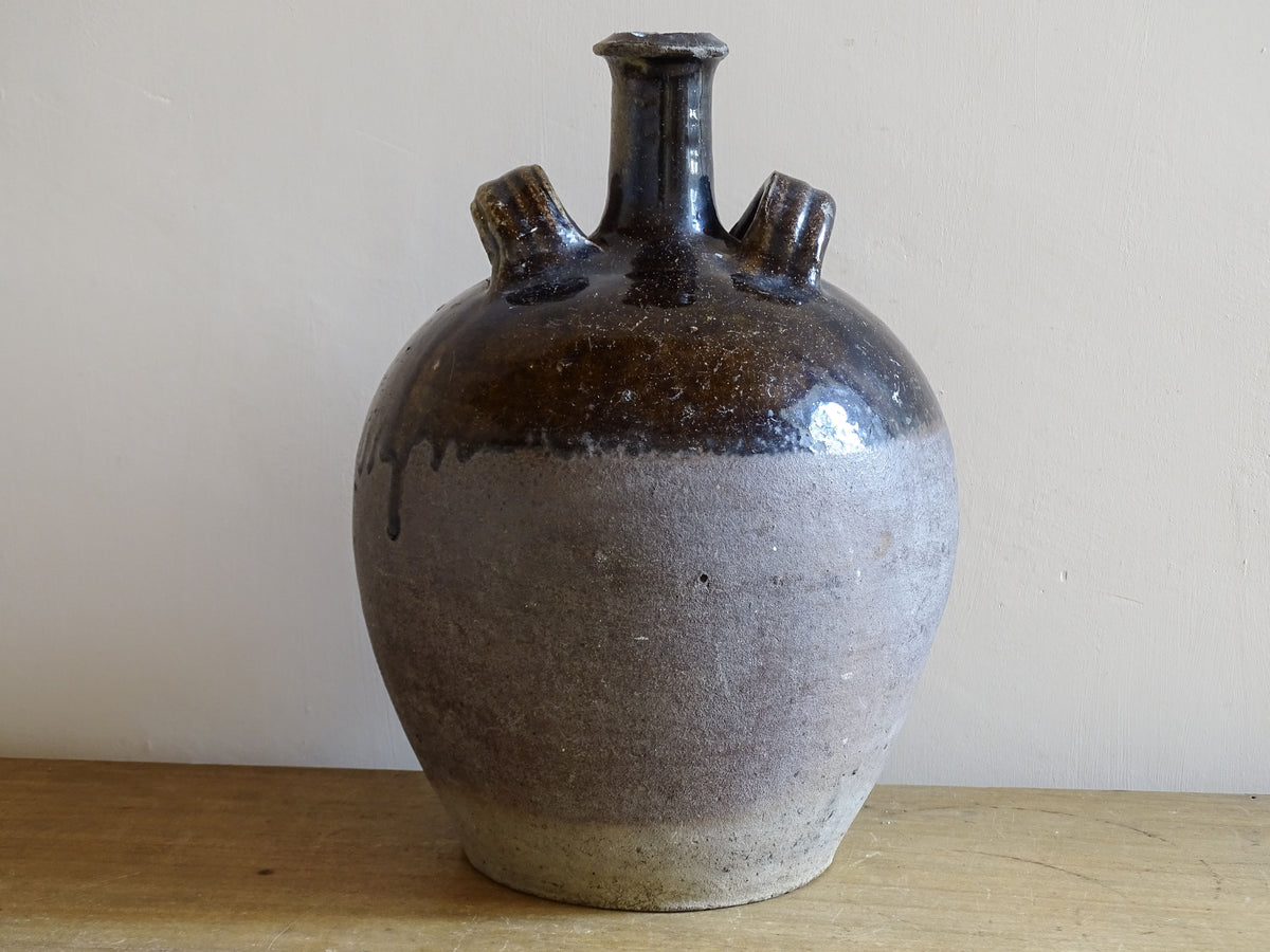 Rustic French earthenware water vessel with dark glaze finish