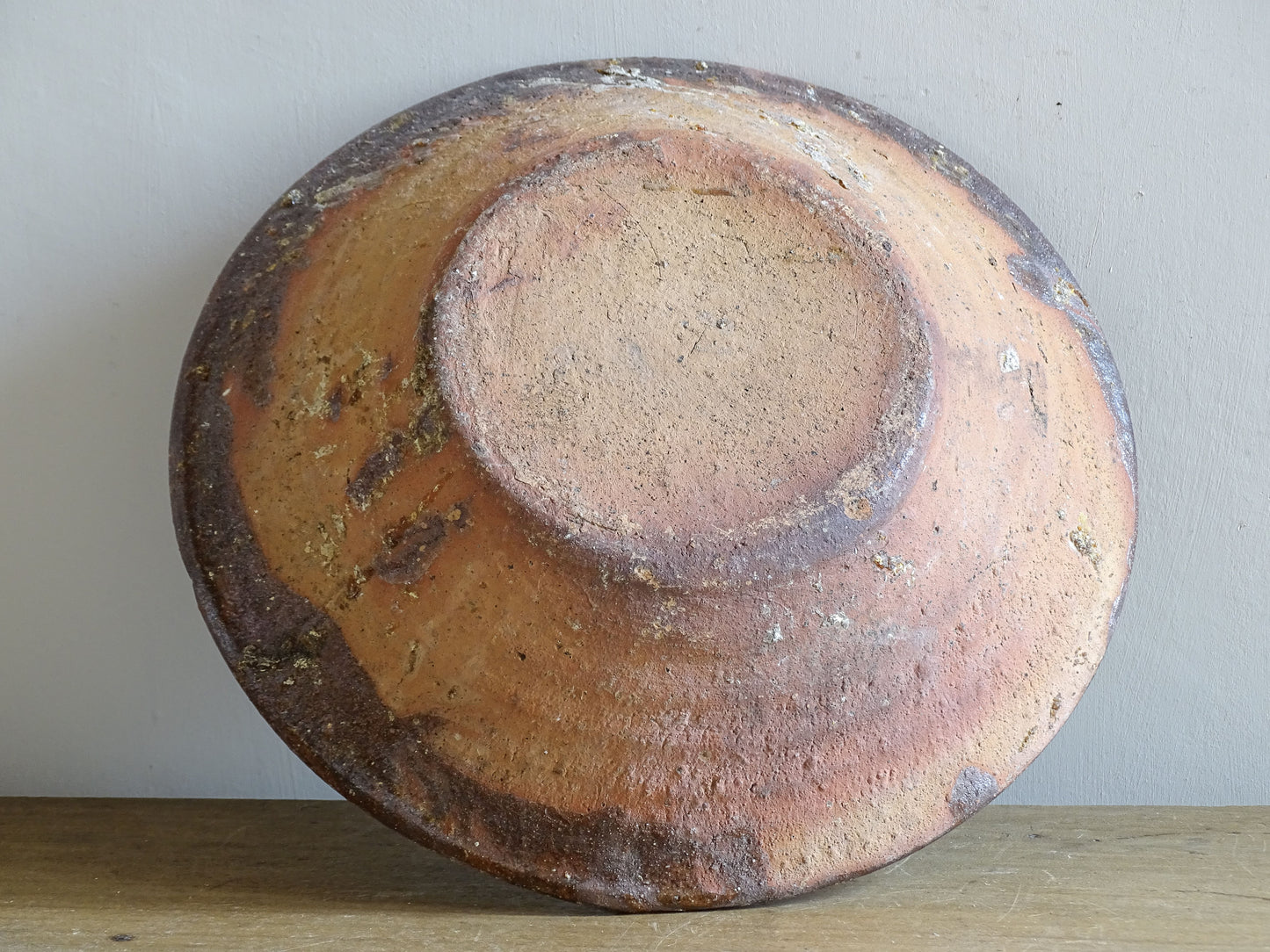 Large rustic French terracotta bowl with timeworn glaze and texture