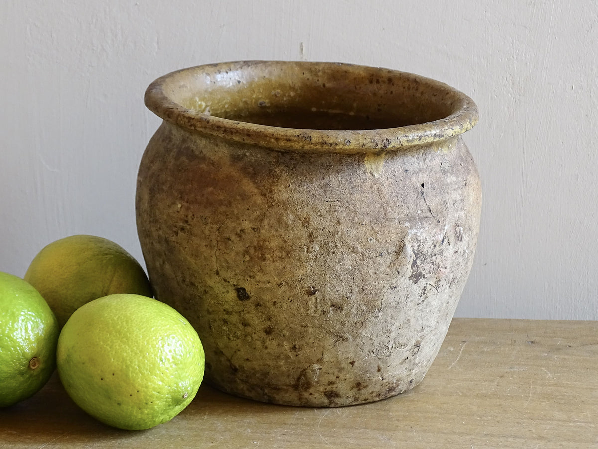 Beautiful French antique confit pot with yellow glaze to the interior and an aged, unglazed terracotta exterior finish.