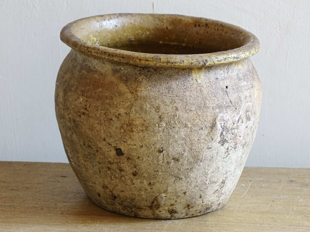 Beautiful French antique confit pot with yellow glaze to the interior and an aged, unglazed terracotta exterior finish.