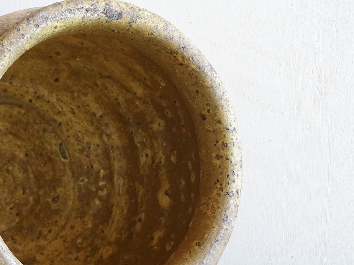 Beautiful French antique confit pot with yellow glaze to the interior and an aged, unglazed terracotta exterior finish.