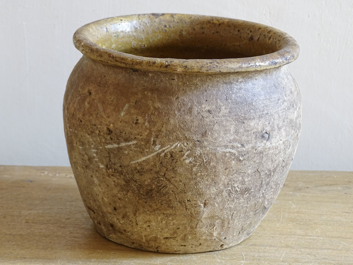 Beautiful French antique confit pot with yellow glaze to the interior and an aged, unglazed terracotta exterior finish.