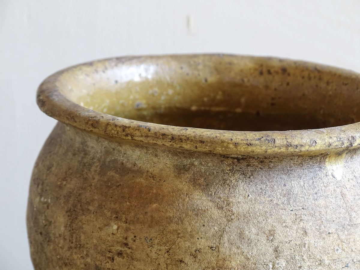 Beautiful French antique confit pot with yellow glaze to the interior and an aged, unglazed terracotta exterior finish.