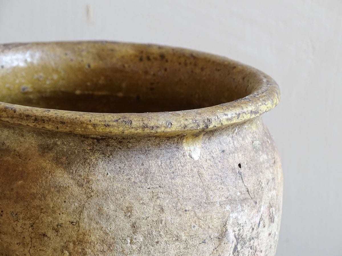 Beautiful French antique confit pot with yellow glaze to the interior and an aged, unglazed terracotta exterior finish.