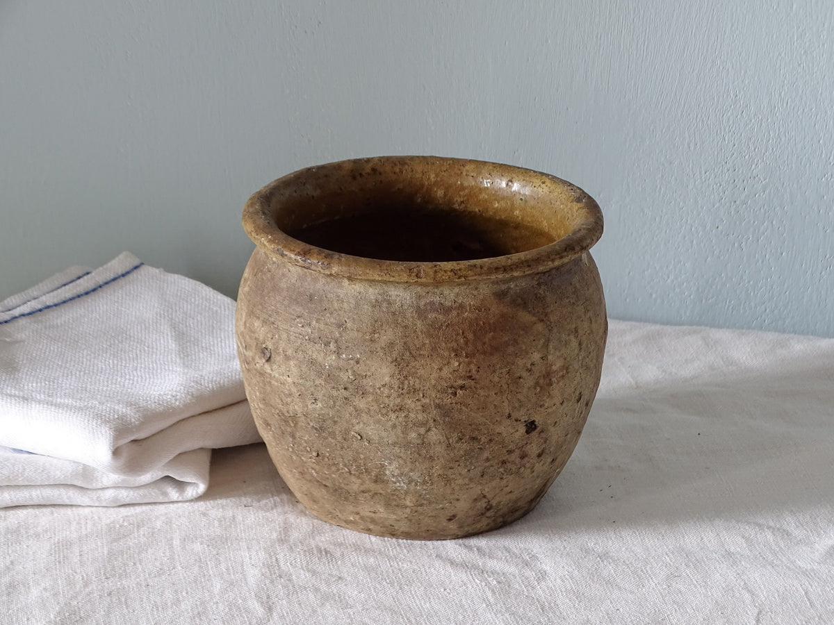 French antique earthenware pot with yellow glaze interior