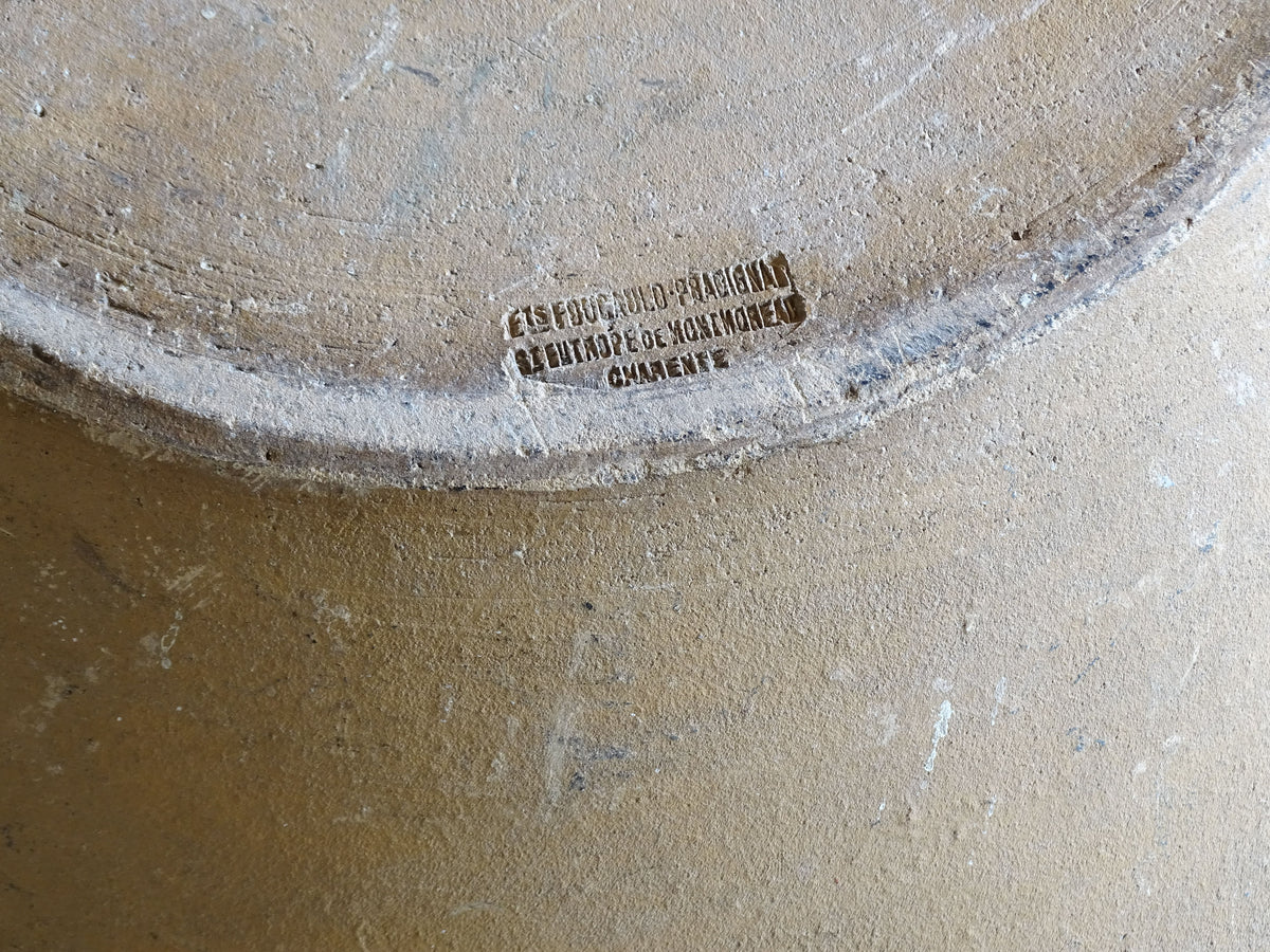 French vintage ceramic mixing bowl from Pérignac, Charente, stamped by a regional pottery workshop. This vintage terracotta bowl has a pale glazed interior and pouring lip.