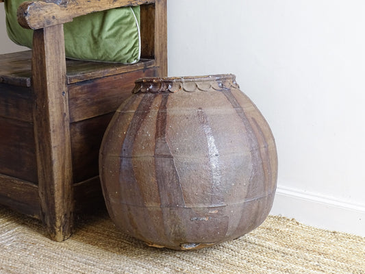 A substantial early 19th century French antique terracotta pot, known as a ponne (salting pot), sourced in the South West region of France and likely Charentais in origin.