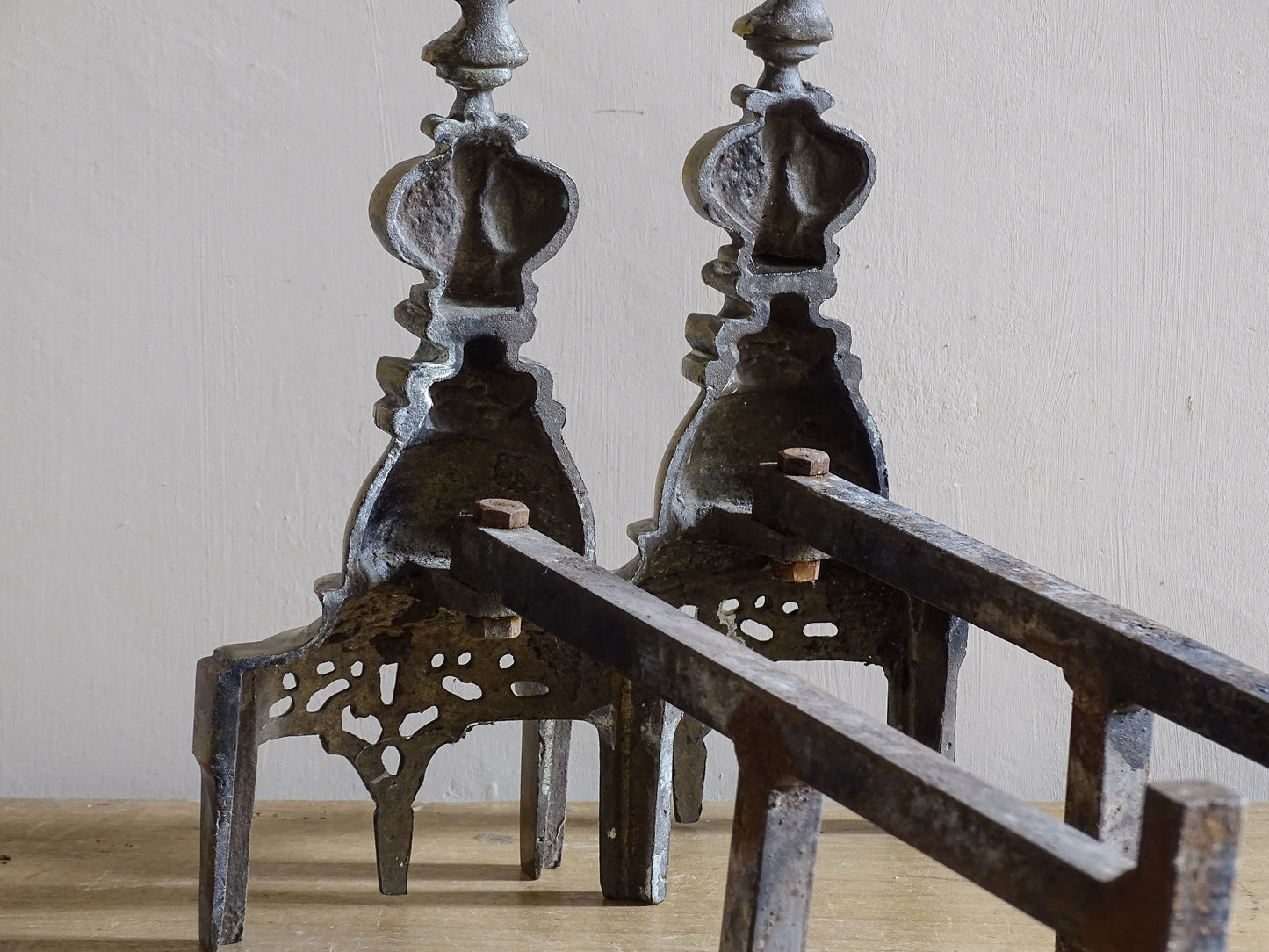 French antique fireplace decor with brass firedogs and iron log supports
